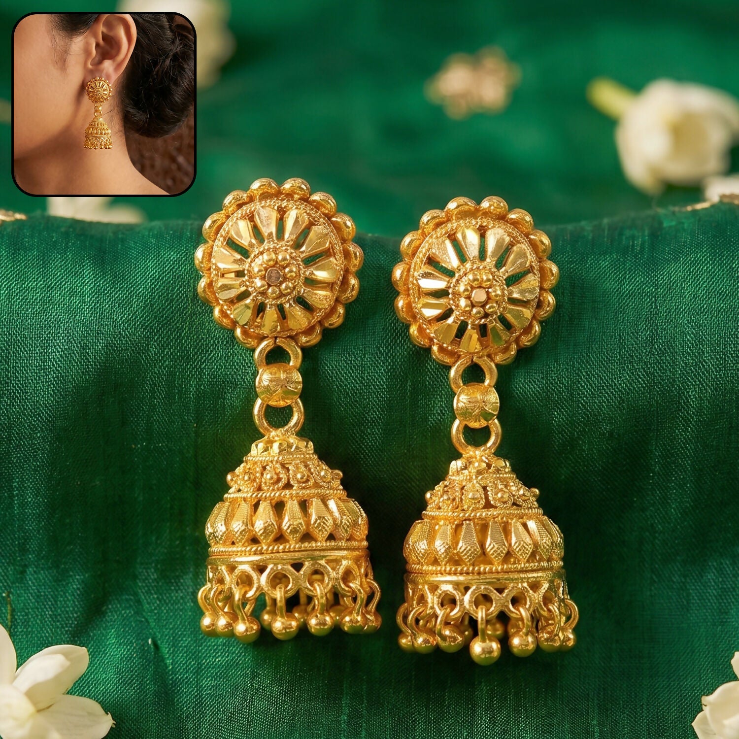 Elegant Gold Jhumka Earrings with Intricate Detailing and Pearls for Bridal Wear