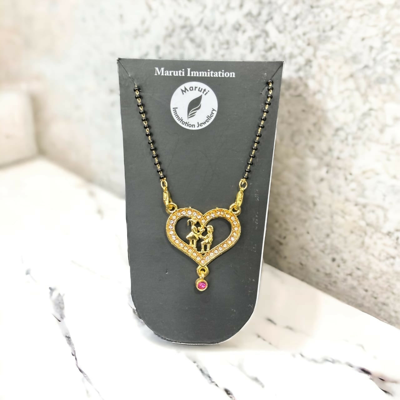 Gold-Tone Heart Mangalsutra with Intricate Couple Pendant and Stone Detailing