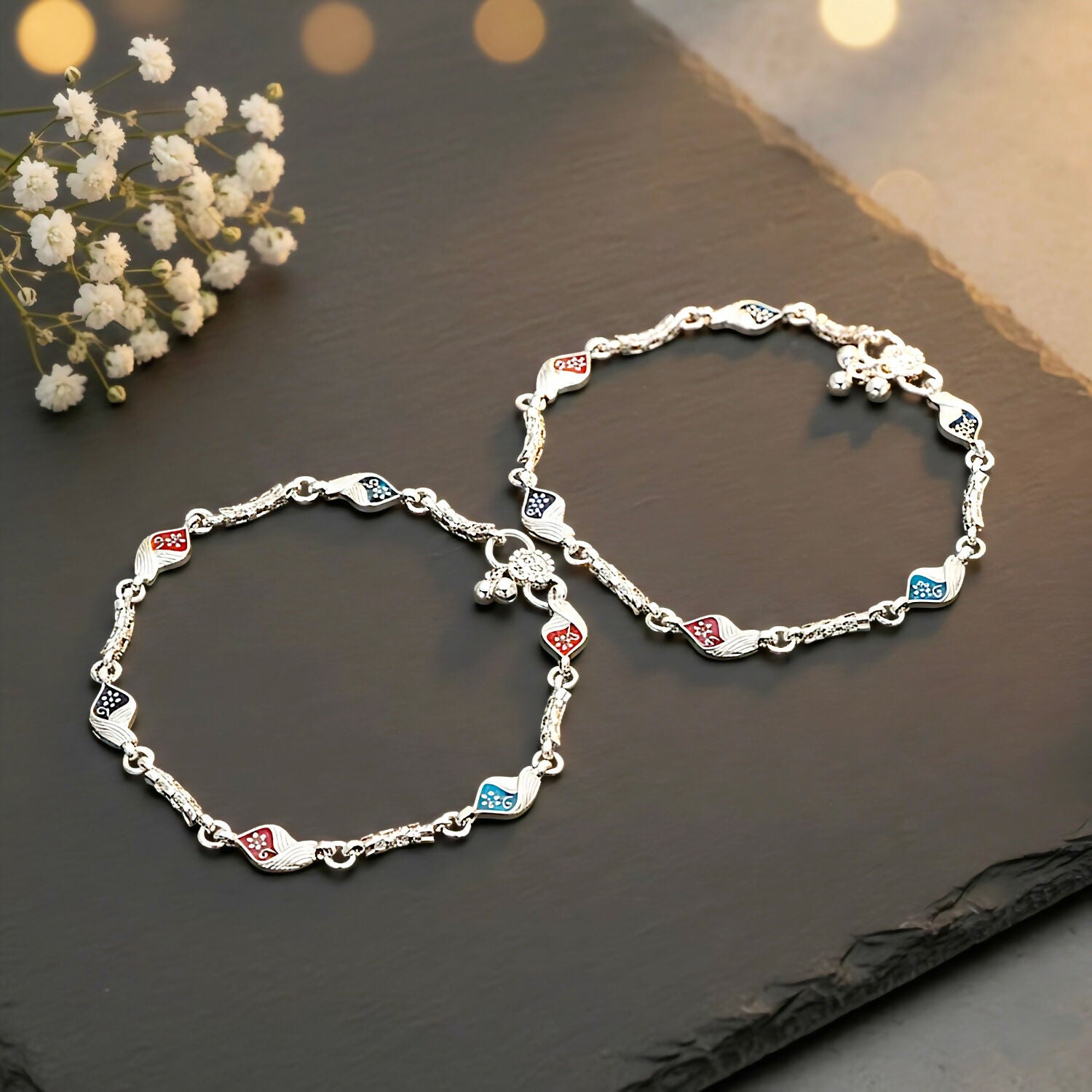 Intricate leaf/floral patterns featuring vibrant red, navy blue, and black enamel anklet ( payal )