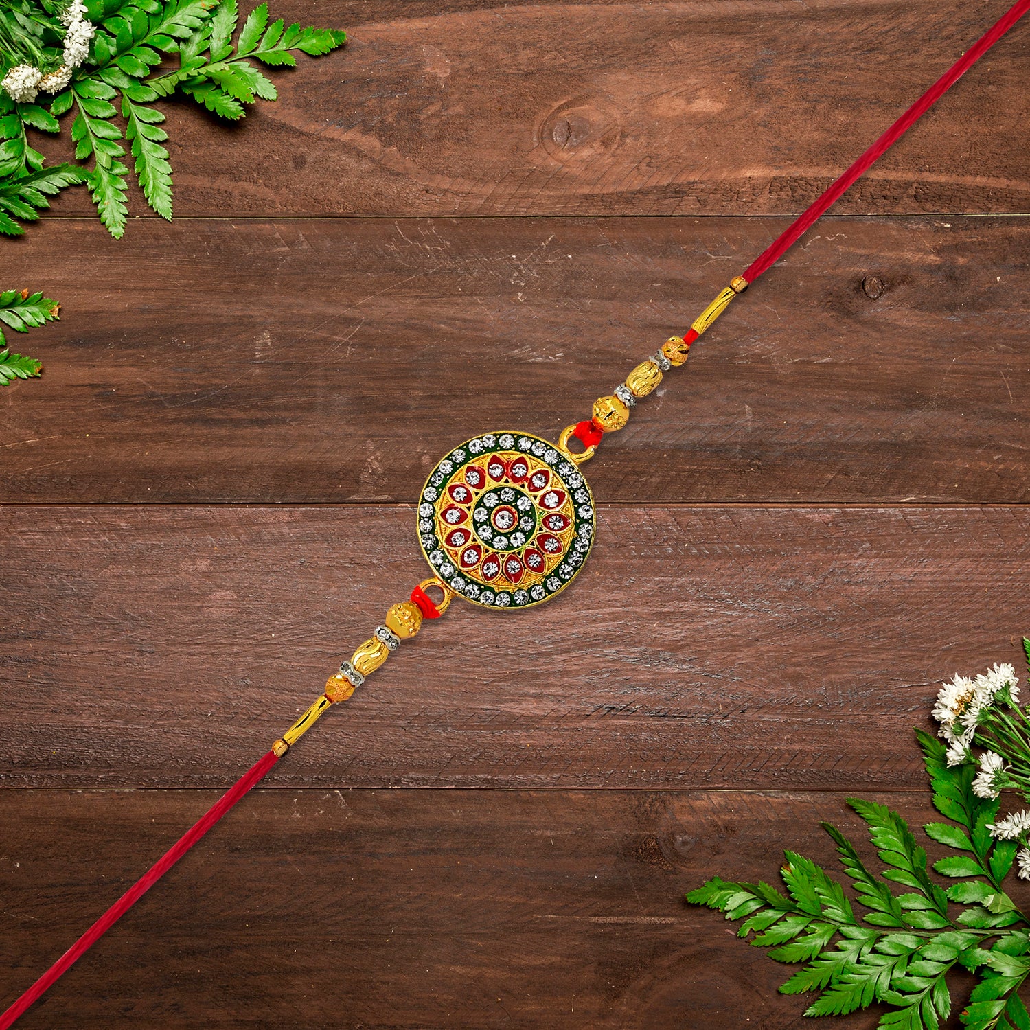 Royal Designer Rakhi with Kundan Centerpiece, Red & Green Enamel Work, and Golden Beads