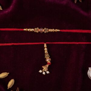 Sleek Stone Bhabhi Rakhi with Golden Latkan